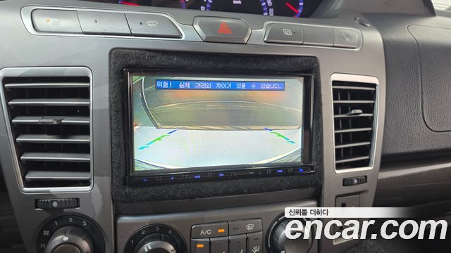 KG Mobility (SsangYong) Korando Turismo 4WD LT 11-seater 2014 — фото 14