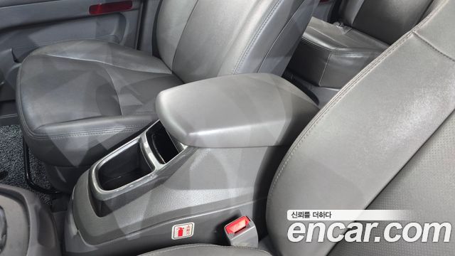 KG Mobility (SsangYong) Korando Turismo 4WD LT 11-seater 2014 — фото 29
