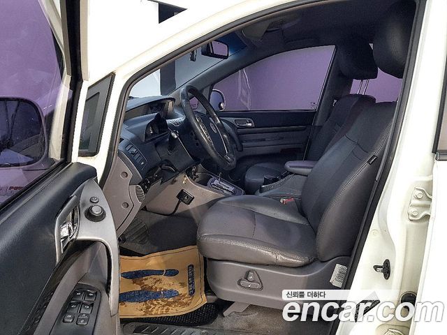 KG Mobility (SsangYong) Korando Turismo 4WD GT 11-seater 2014 — фото 8