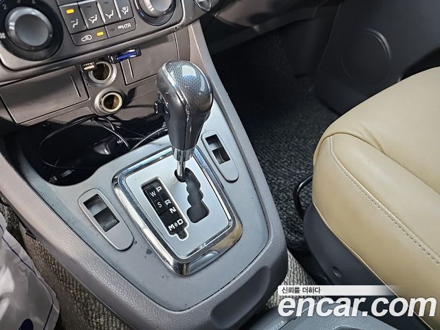 KG Mobility (SsangYong) Korando Turismo 4WD LT 11-seater 2014 — фото 7