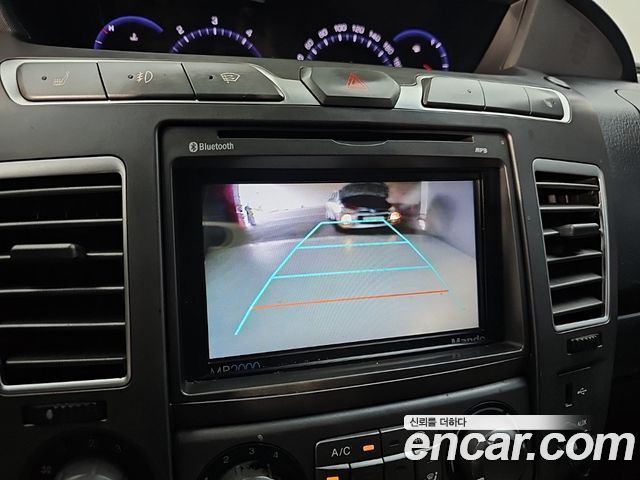 KG Mobility (SsangYong) Korando Turismo 4WD LT 11-seater 2014 — фото 18