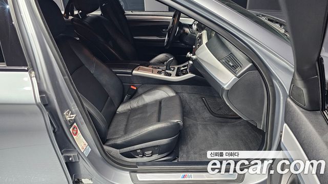 BMW 5 Series (F10) 550i xDrive 2012 — фото 11