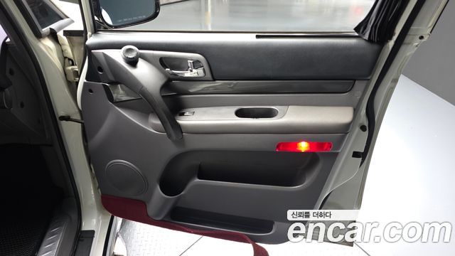 KG Mobility (SsangYong) Korando Turismo 4WD GT 11-seater 2014 — фото 24