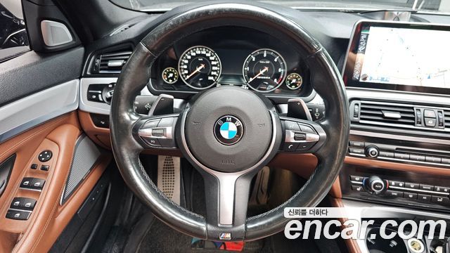 BMW 5 Series (F10) M550d xDrive 2014 — фото 12
