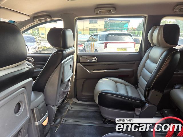 KG Mobility (SsangYong) Korando Turismo 4WD GT 11-seater 2014 — фото 19