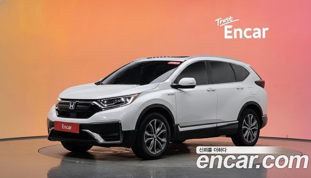 Honda CR-V (V) 2.0 Hybrid Touring 4WD 2021 — фото 1