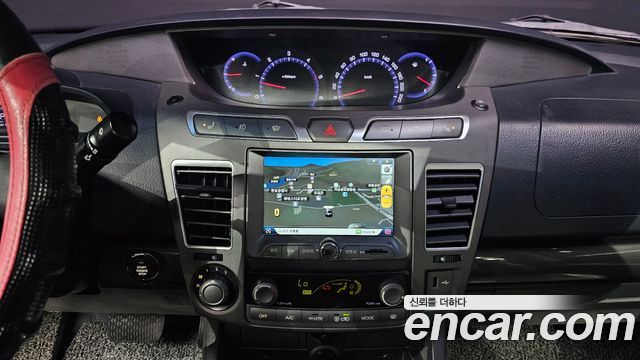 KG Mobility (SsangYong) Korando Turismo 4WD RT 11-seater 2014 — фото 15